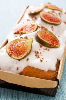 Delicious fig cake on blue background