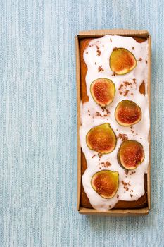 Delicious fig cake on blue background