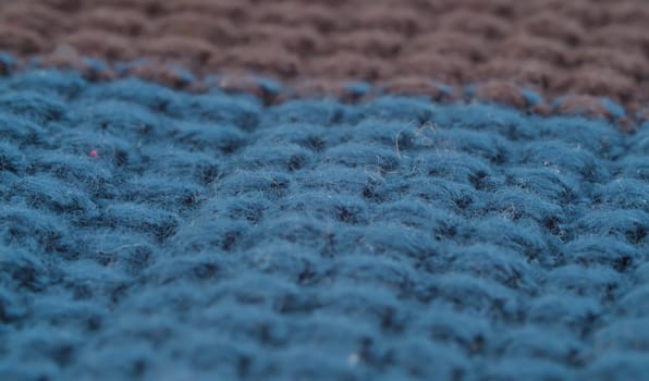 Extreme close up multicolored woolen fabric. Texture, textile background. Macro shooting