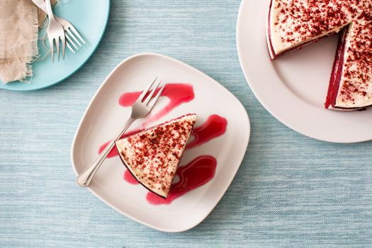 Red Velvet cake slice on blue background