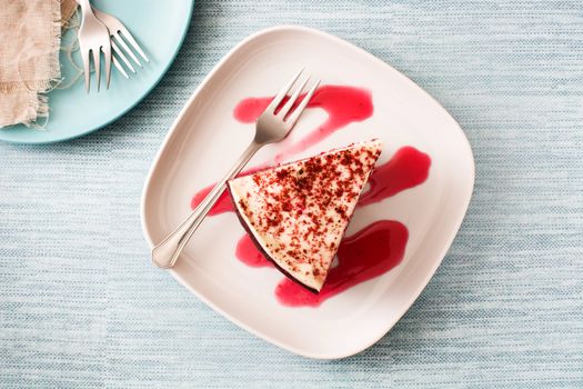 Red Velvet cake slice on blue background