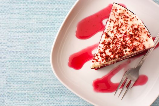 Red Velvet cake slice on blue background