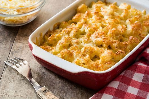 Typical American macaroni and cheese on wooden table