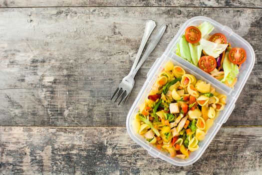Lunch box with healthy food ready to eat Pasta salad on wooden table