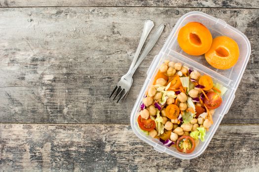 Lunch box with healthy food ready to eat.Chickpea salad on wooden table