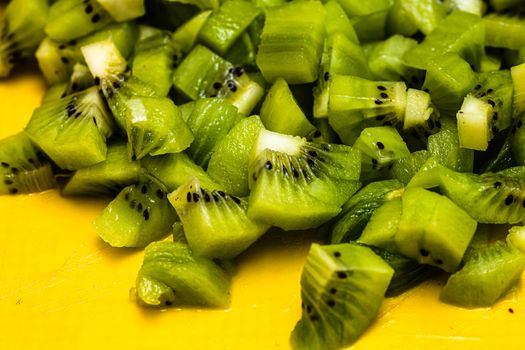 Ripe kiwi fruit. Detail of chopped exotic kiwi fruits used for desserts