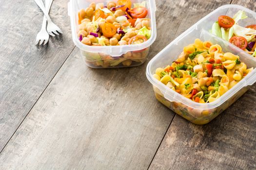 Lunch box with healthy food ready to eat on wooden table