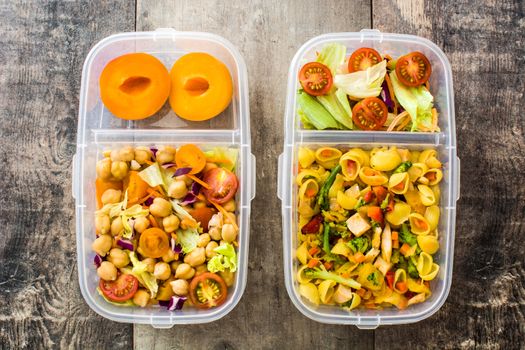 Lunch box with healthy food ready to eat on wooden table