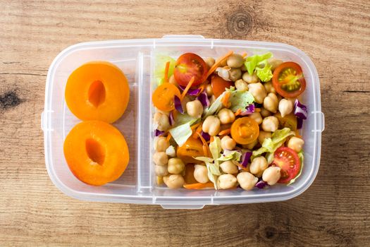 Lunch box with healthy food ready to eat.Chickpea salad on wooden table