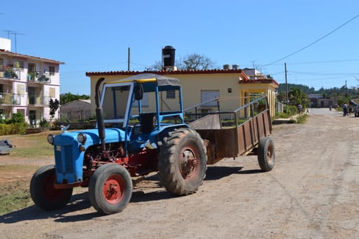 Vinales, Cuba, March 2011: old and vintage blue tractor in the streets of Vinales