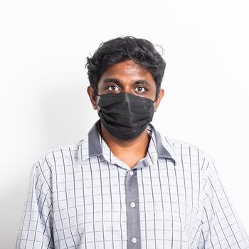 Asian happy portrait young black man wearing face mask protective from virus coronavirus epidemic or air pollution looking camera, studio shot isolated on white background, stop COVID-19 concept 