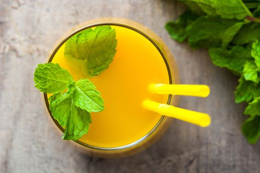 Mango Lassi dessert. Traditional Indian drink on wooden table. Copyspace