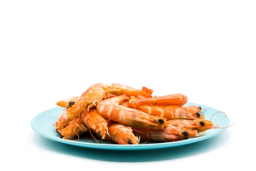 Grilled shrimps on blue plate isolated on white background