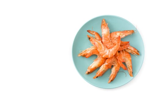 Grilled shrimps on blue plate isolated on white background