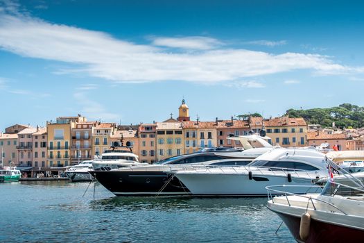 Saint-Tropez and its fishing port and its yachts in summer in France