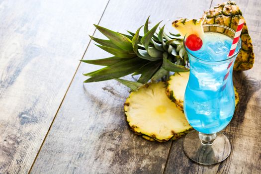 Blue Hawaiian cocktail on wooden table