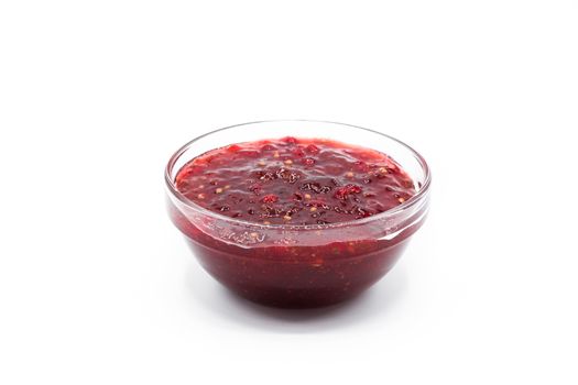 Cranberry sauce in bowl for Thanksgiving dinner isolated on white background