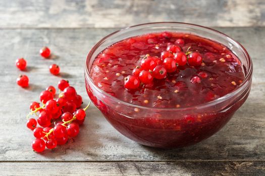 Cranberry sauce in bowl for Thanksgiving dinner on wooden table