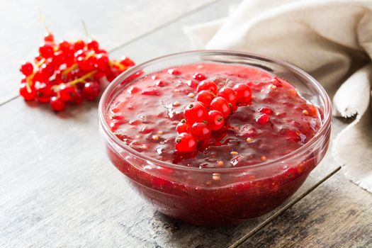 Cranberry sauce in bowl for Thanksgiving dinner on wooden table