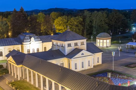 Frantisek Pavilion which houses Frantisek mineral spring and other spa and colonnade buildings from above are the most famous structures in Frantiskovy Lazne Spa town in the North Czech Republic. Seen from above at night