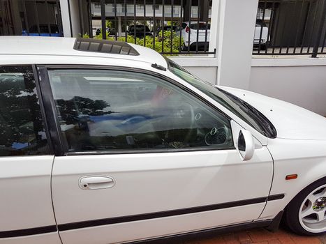 Small white car in Claremont Newlands, Cape Town, South Africa.