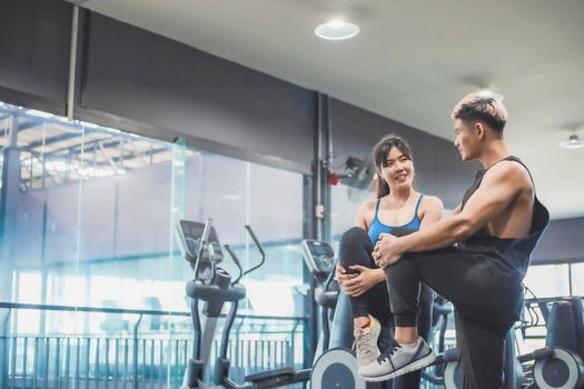 Asian couples exercise before running on the treadmill.Athletic exercises.Metaphor Fitness and workout concept exercise Health lifestyle muscle body with take care of your health