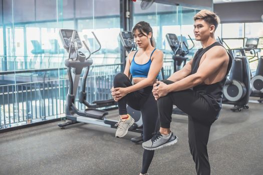 Asian couples exercise before running on the treadmill.Athletic exercises.Metaphor Fitness and workout concept exercise Health lifestyle muscle body with take care of your health