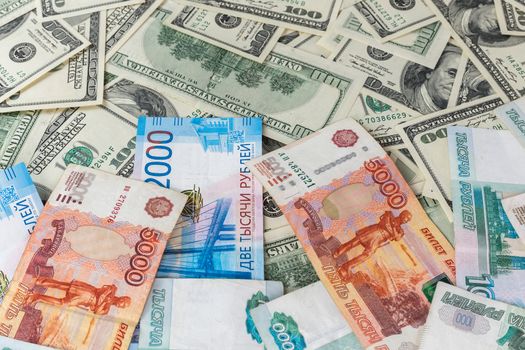 russian rubl and us dollar banknotes close-up with selective focus and blur