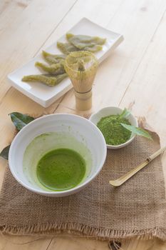 Set of matcha powder bowl, wooden spoon and whisk, green tea leaf, Organic Green Matcha Tea ceremony.