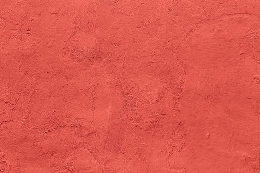 flat live coral color plaster wall matte texture.