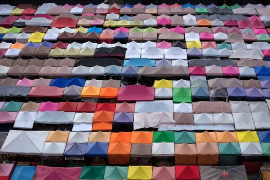 Colorful food stalls at Rod Fai Night Market in Bangkok