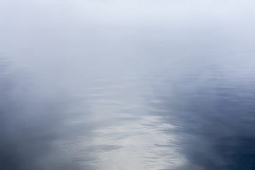 fog over water abstract background with selective focus and shallow depth of field.