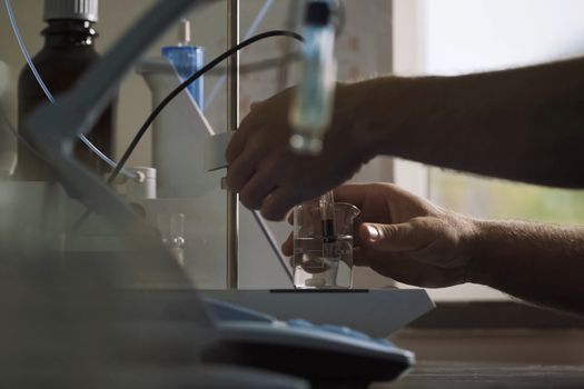 The biological fertilizer is drawn into a syringe. Analyzes in the laboratory.