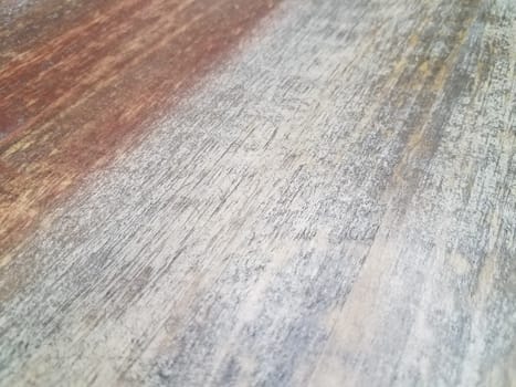 worn and faded brown and grey wood table or surface