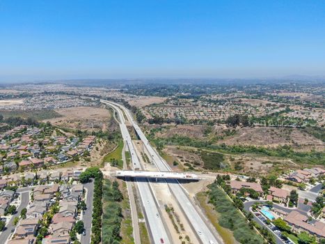 Aerial view of highway, freeway road with vehicle in movement in San Diego, California, USA.