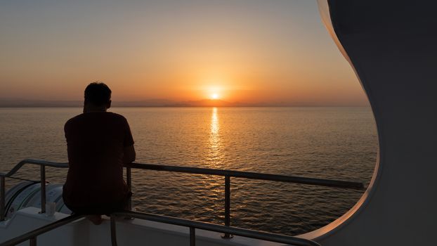 Beautiful sunset over the horizon with deep blue sea