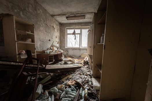 Abandoned and messy room in Pripyat post office angle shot