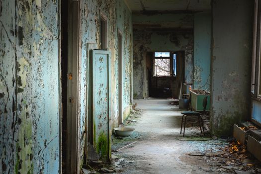 Abandoned corridor in Pripyat Hospital, Chernobyl Exclusion Zone 2019 angle shot