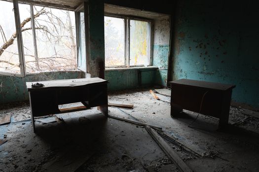 Abandoned and messy room in Pripyat post office angle shot