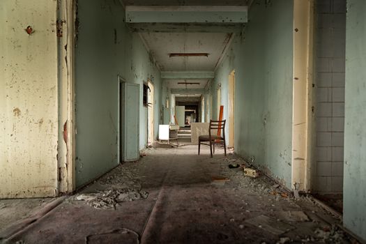 Abandoned corridor in Pripyat Hospital, Chernobyl Exclusion Zone 2019 angle shot