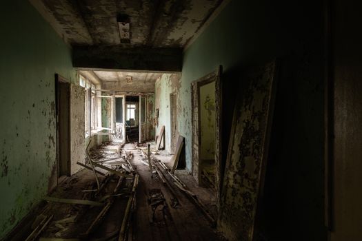 Abandoned corridor in Pripyat Hospital, Chernobyl Exclusion Zone 2019 angle shot