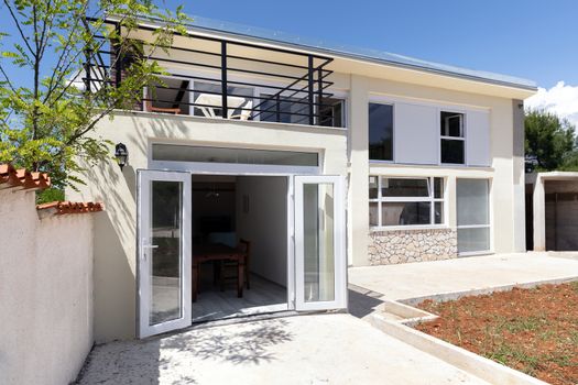 Modern apartment exterior angle shot under blue sky