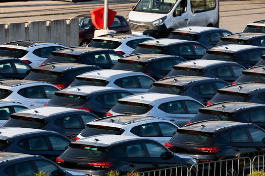 Lot of cars being transported to trade location closeup photo