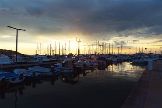 Sunset at boat marina with dramatic sky anle shot