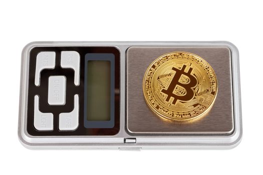 A bitcoin shiner on electronic pocket weight isolated on white background with selective focus and blur