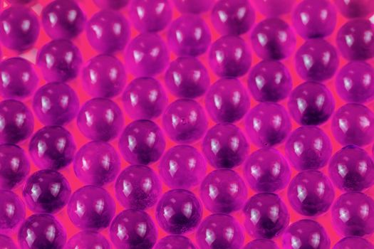proton purple spherical ball capsules selective focus weird abstract background.