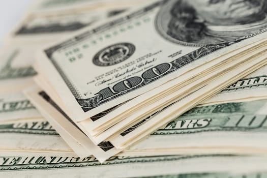 united states of america old dollar banknotes close-up background with selective focus - small stack over other