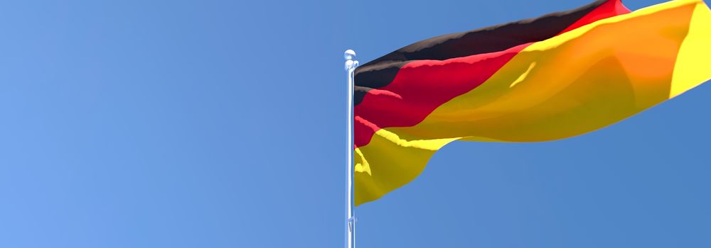 3D rendering of the national flag of Germany waving in the wind against a blue sky