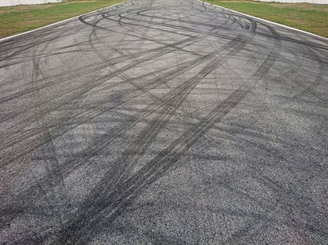 Background with tire marks on road track