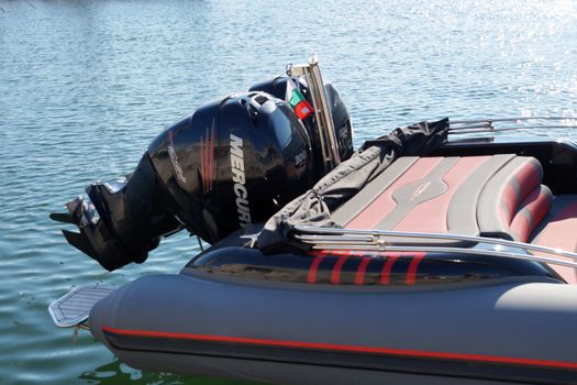 Varna, Bulgaria - August, 01,2020: outboard motor on the transom of an inflatable marine boat